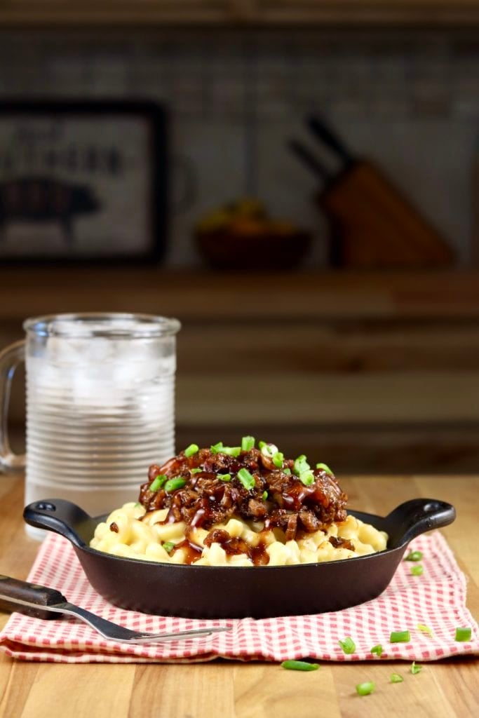Brisket Mac and cheese with a glass of ice water 