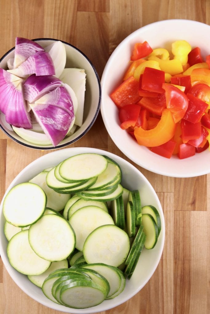sliced onions, peppers and zucchini for grilling kebabs