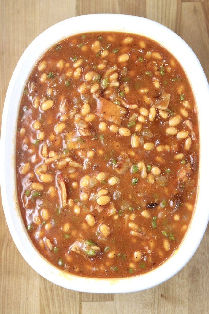 Baked beans in a casserole dish ready to bake