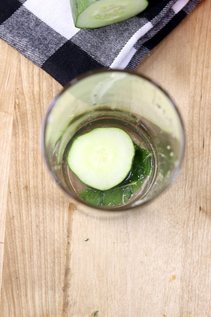 Cucumber, mint and lime juice to muddle in a glass for mojitos