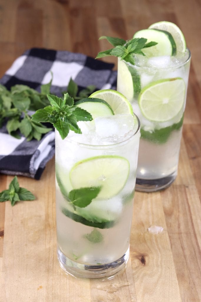 Cucumber Mojito Cocktails garnished with cucumber, lime and mintCucumber Mojitos are one of the most refreshing and delicious cocktails you'll ever taste! Great for hot summer days and so easy to mix up by the glass. 