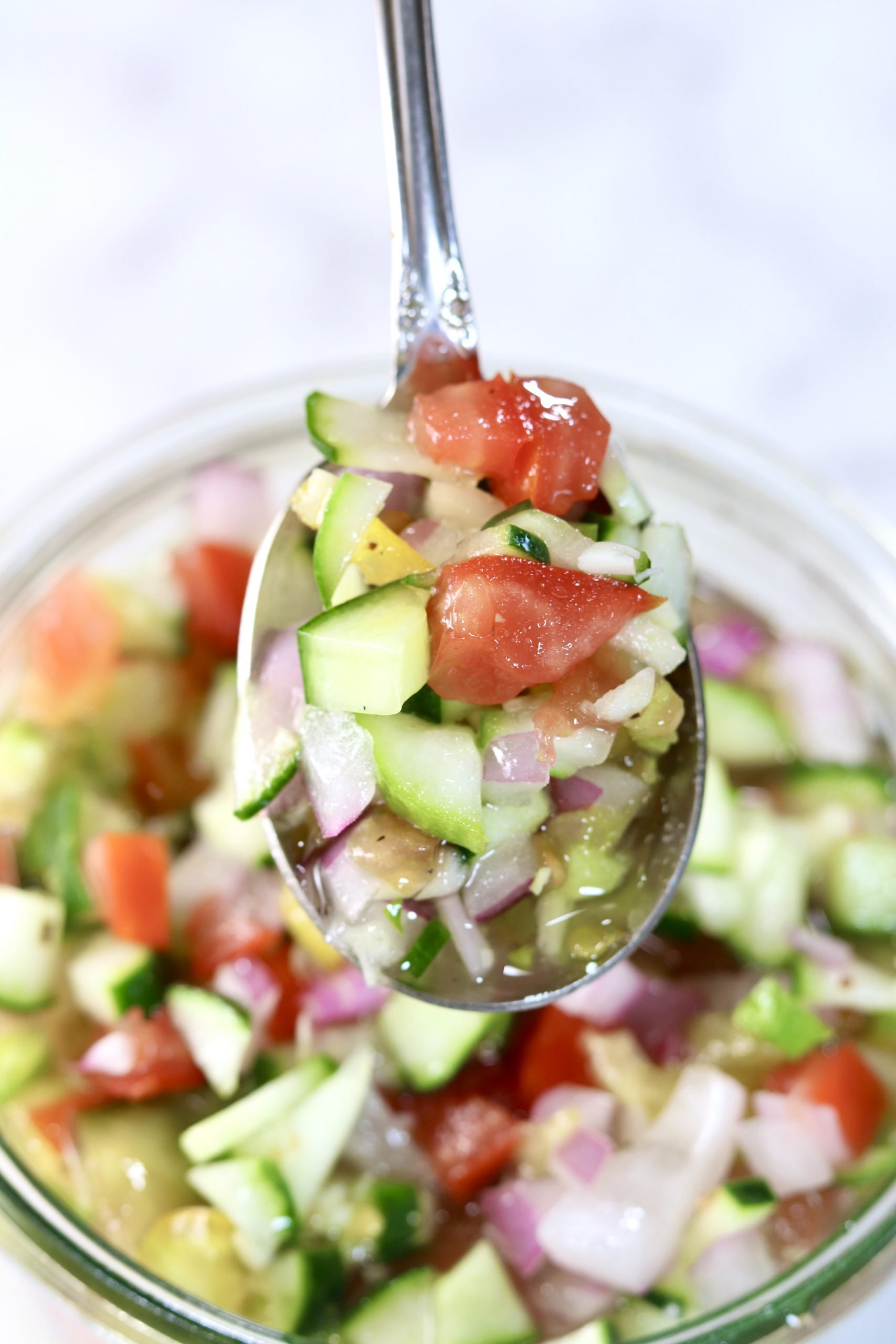 Cucumber Tomato Salad - close up of spoonful