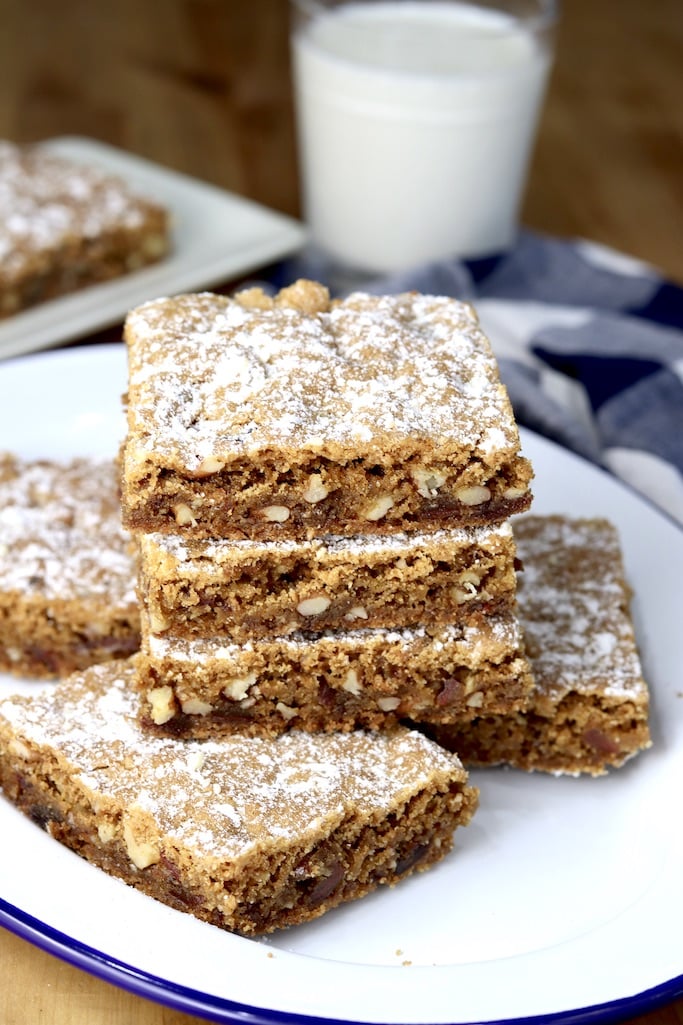 Plate of date and nut bars with powdered sugar