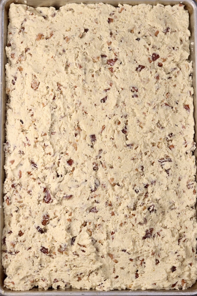 Chewy Date Bar dough spread in a pan