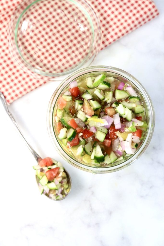 Cucumber Tomato Salad in a jar, spoonful to the side