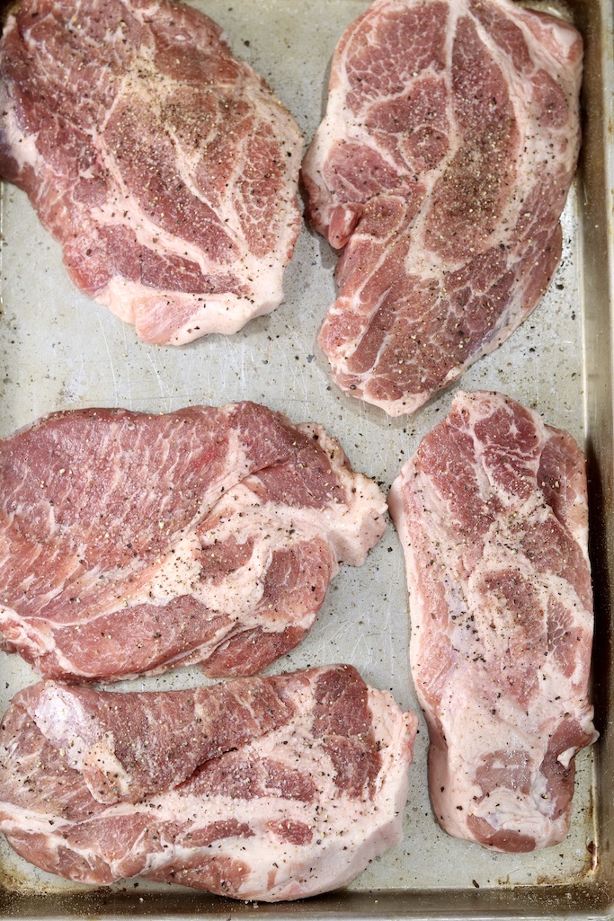 sheet pan of pork steaks
