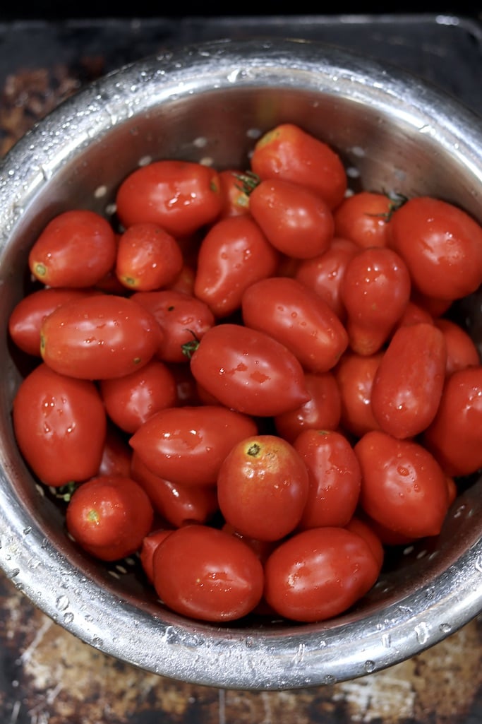 Colander full of ripe Roma Tomatoes