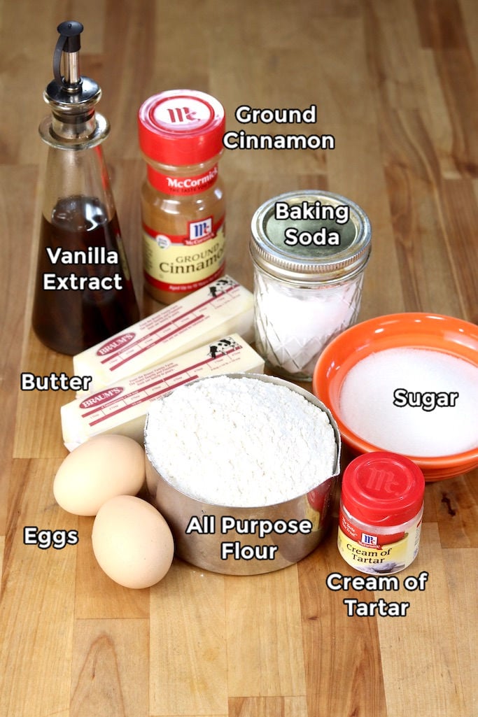 Ingredients with text labels for Snickerdoodles: Vanilla, Butter, Eggs, Sugar, Baking Soda, Cream of Tartar, Cinnamon