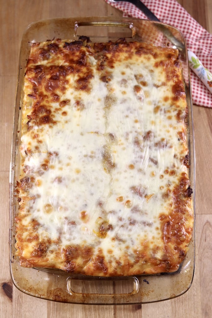 cheesy baked lasagna in a glass baking dish