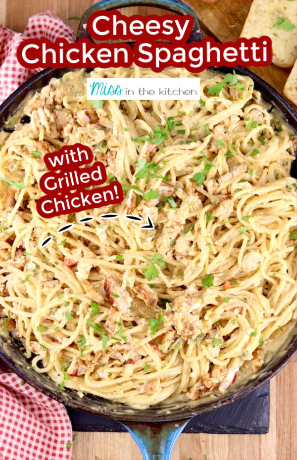 Skillet of chicken spaghetti with text overlay "Cheesy Chicken Spaghetti" "with grilled Chicken"