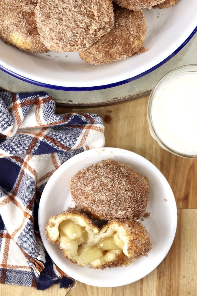 Apple Pie bombs with cinnamon and sugar plated and in a pie plate