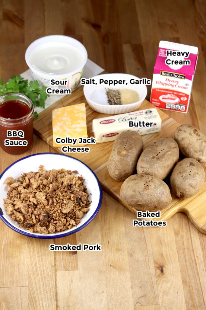 Ingredients to make pulled pork twice baked potatoes- butter, sour cream, cheese, bbq sauce