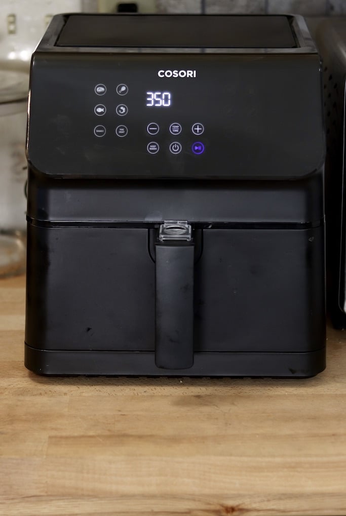 Cosori Air Fryer on cabinet