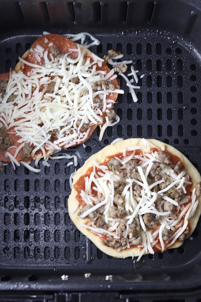 2 mini pizzas in air fryer basket
