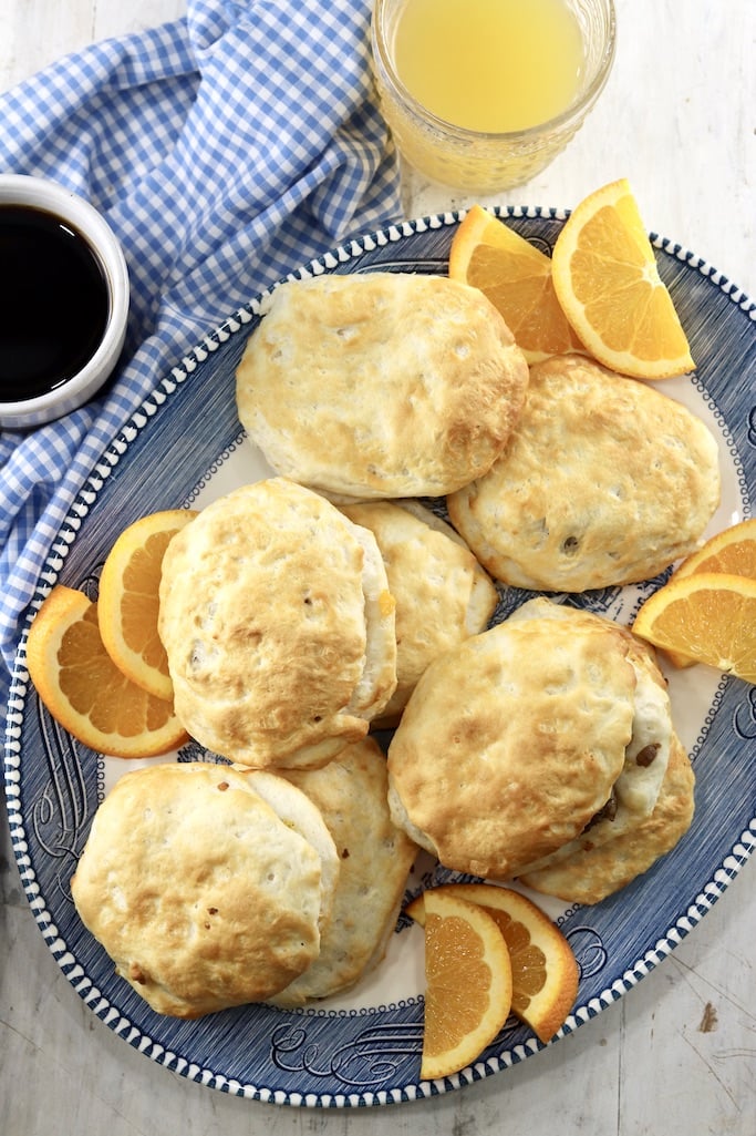 Breakfast biscuit pockets on a platter with coffee and juice