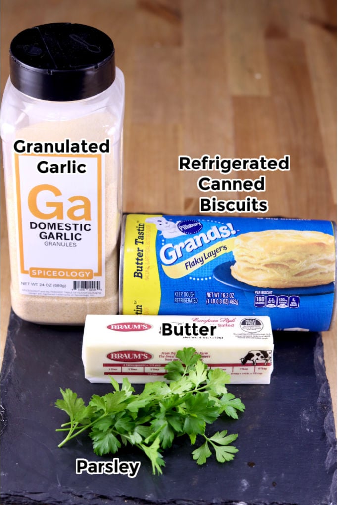Ingredients for Air Fryer Breadsticks: granulated garlic, canned biscuits, butter, parsley