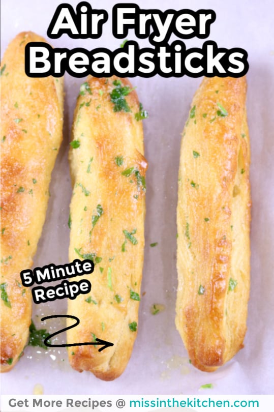 Air Fryer Breadsticks on white parchment - text overlay