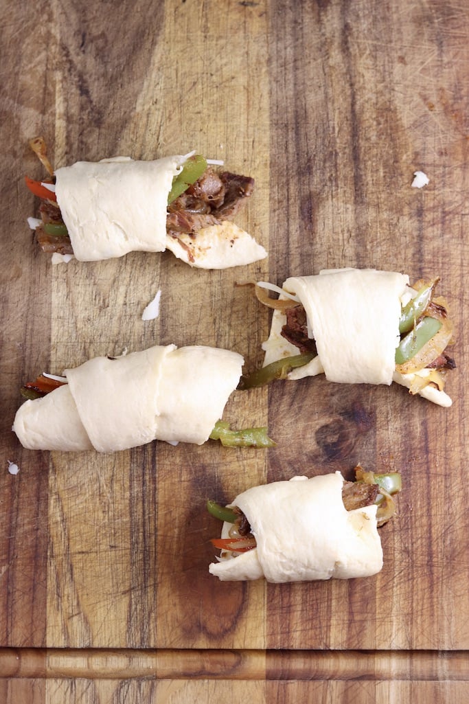 crescent rolls stuffed with roast beef, peppers and onions