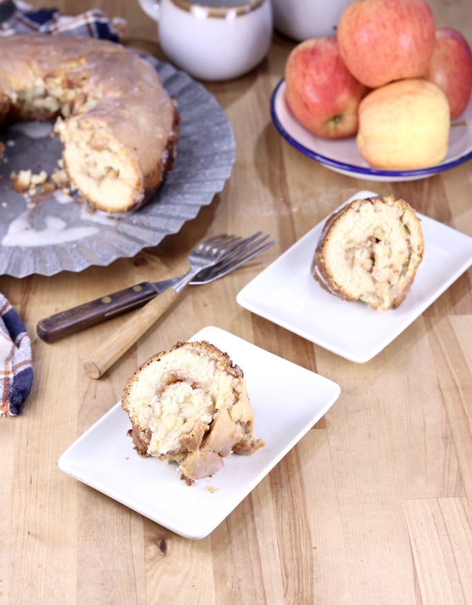 Sliced Apple Coffee Cake - 2 plates with cake platter and bowl of apples