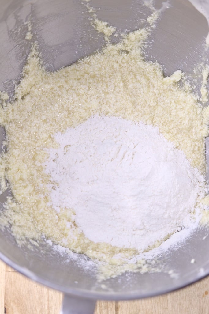 Add flour to coffee cake mixture in a bowl 