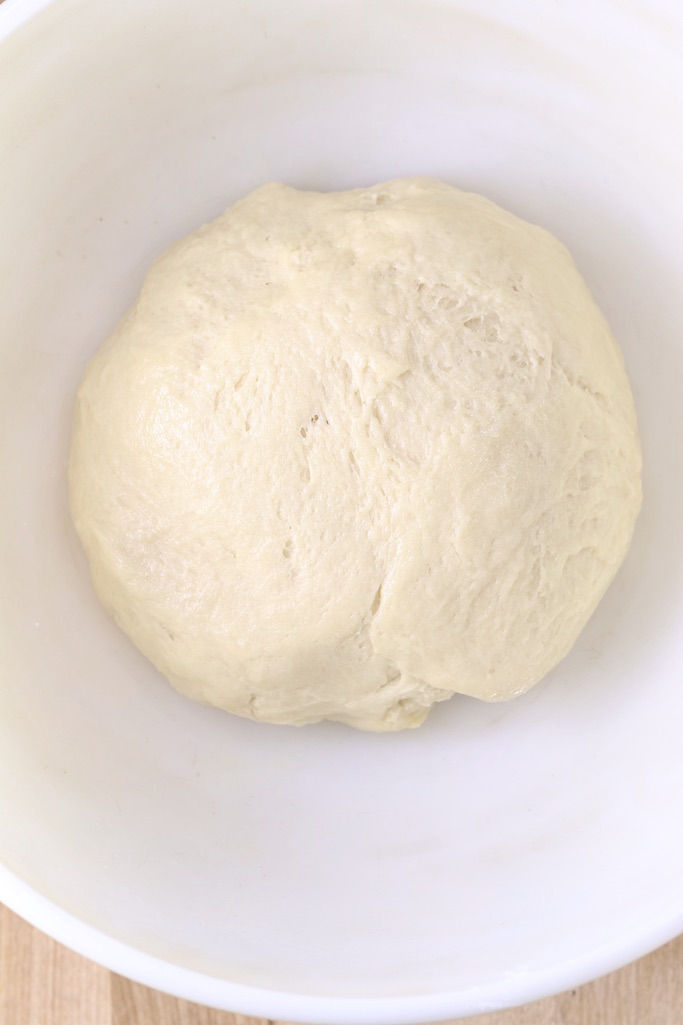 Dough for coffee cake in a bowl to rise
