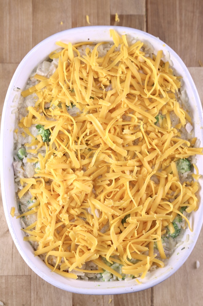 Broccoli Rice Casserole topped with shredded cheese