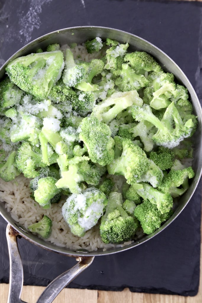 frozen broccoli in a pan of rice