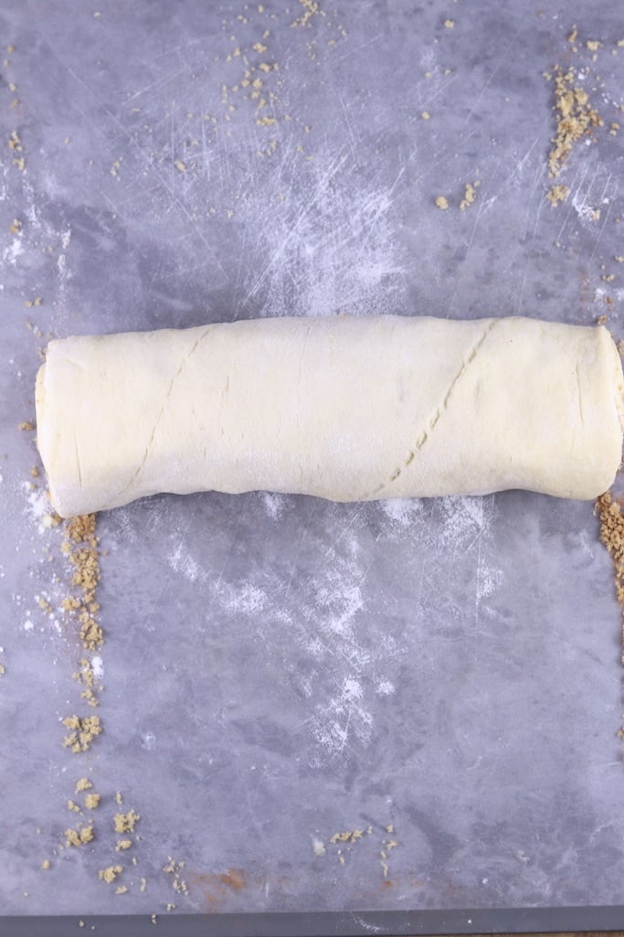 Roll of apple cinnamon rolls dough