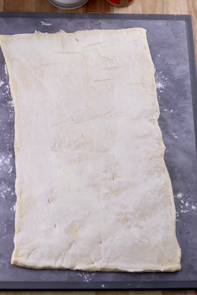 Crescent dough rectangle spread with butter