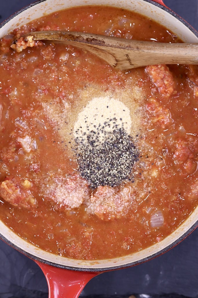 tomato sauce in a pan with garlic, salt and pepper