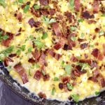 Bacon White Cheddar Corn in a skillet with parsley garnish