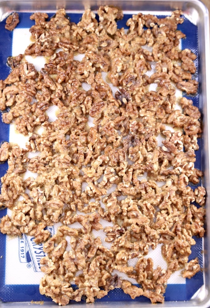 toasted candied walnuts on a silpat lined baking sheet