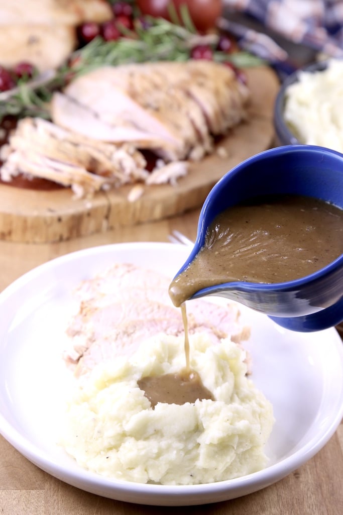 Homemade gravy poured over mashed potatoes