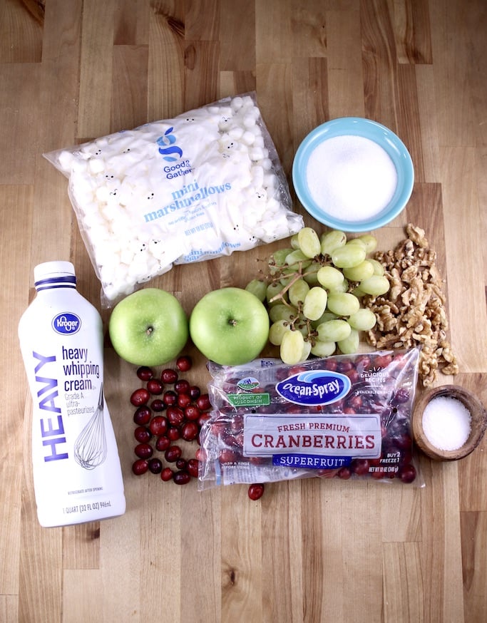 Ingredients for cranberry fluff with apples, grapes, mini marshmallows, heavy cream, walnuts, salt