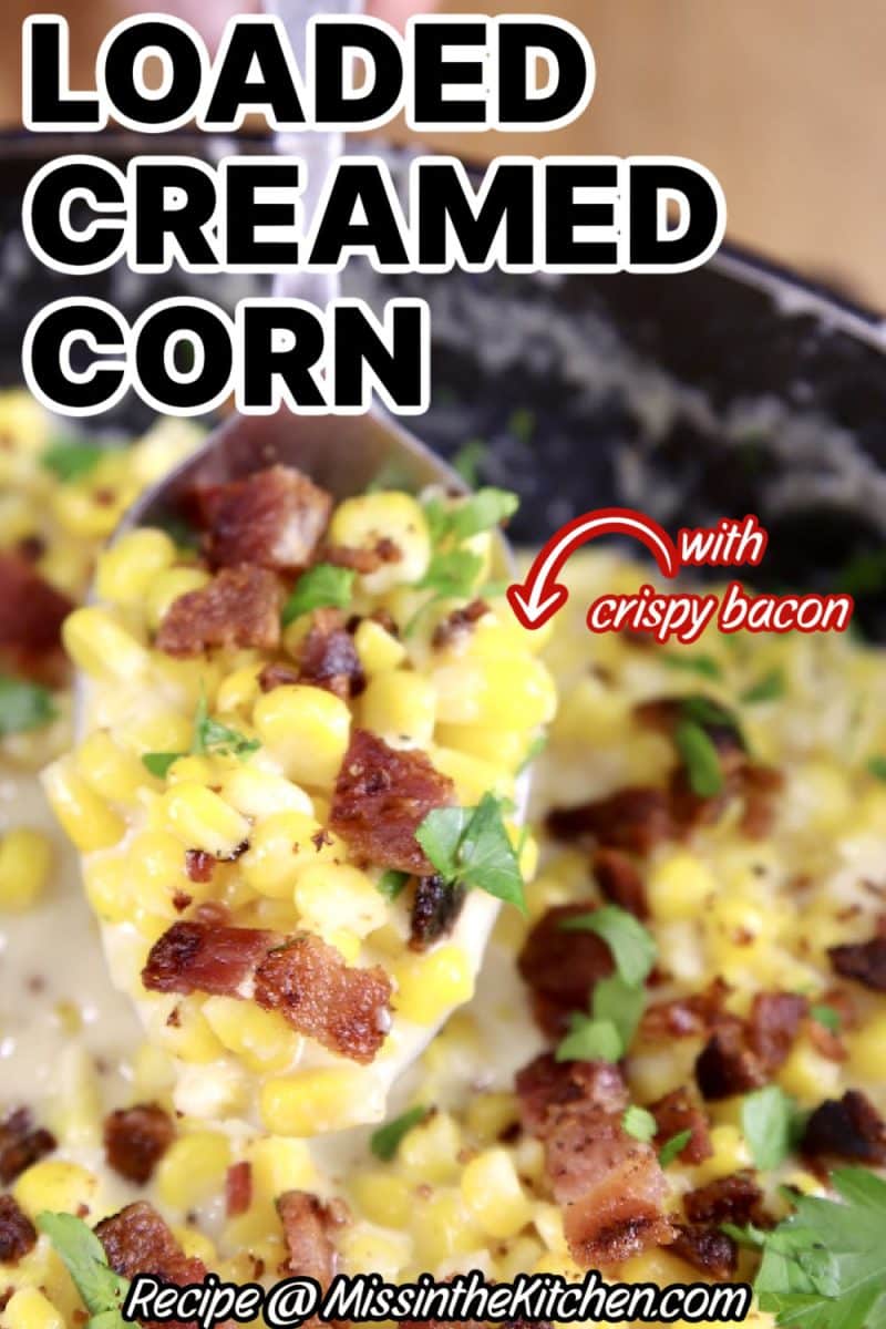 Spoonful of loaded creamed corn with crispy bacon.