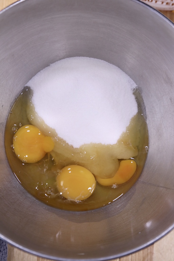 Bowl with eggs, vanilla and sugar