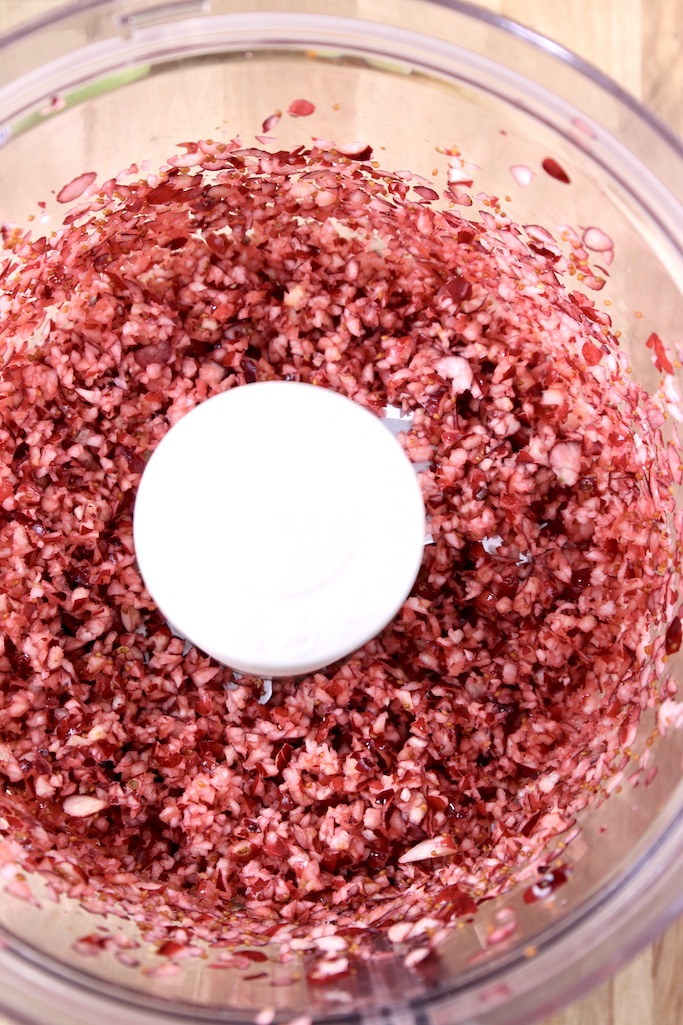 ground fresh cranberries in a food processor bowl