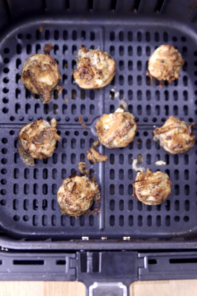 Sausage stuffed mushrooms cooked in an air fryer basket