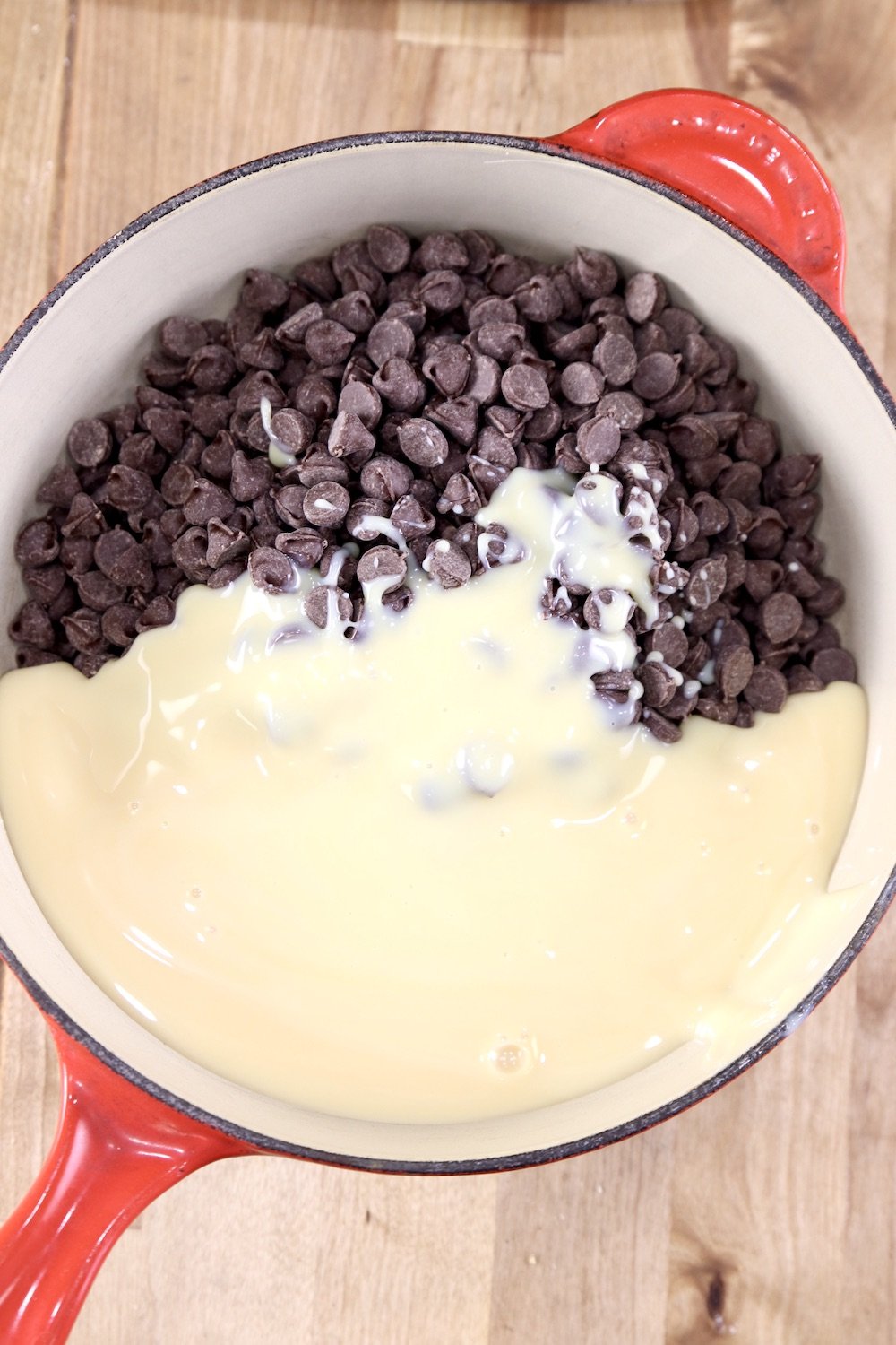 Chocolate Chips with sweetened condensed milk in a pan for making fudge