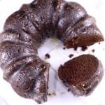 Chocolate Rum Bundt Cake with slice of cake on platter with the cake