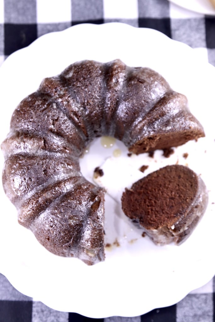 Chocolate Rum Bundt Cake with one slice on it's side 