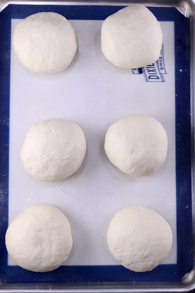 Bread bowl dough ready to rise on a baking sheet
