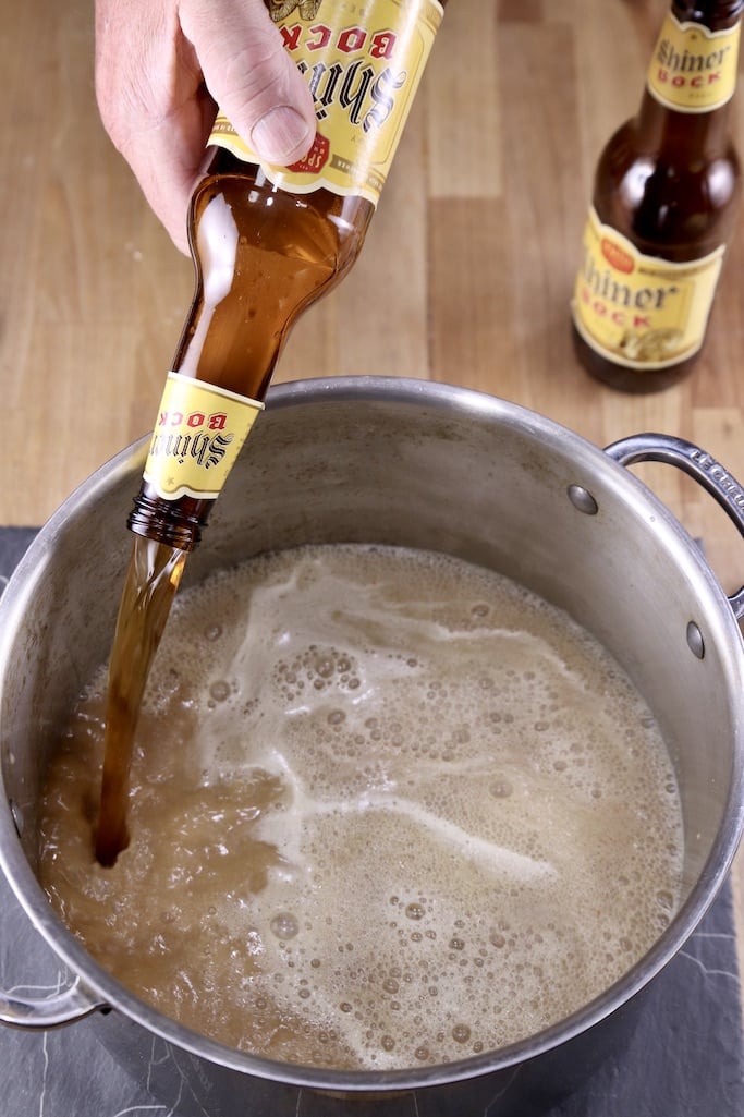 Pouring Shiner Bock beer into a soup pot