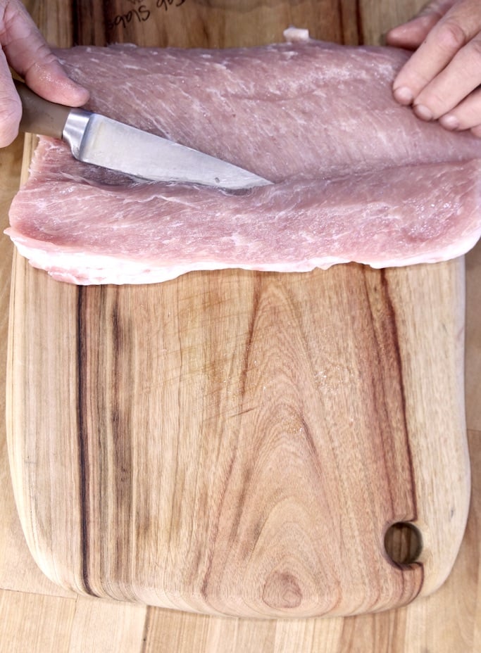 Slicing a pork tenderloin to stuff