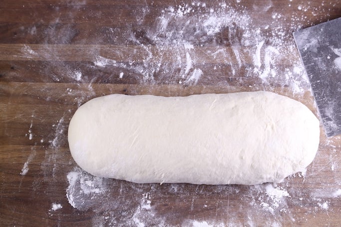 Bread dough formed into a log