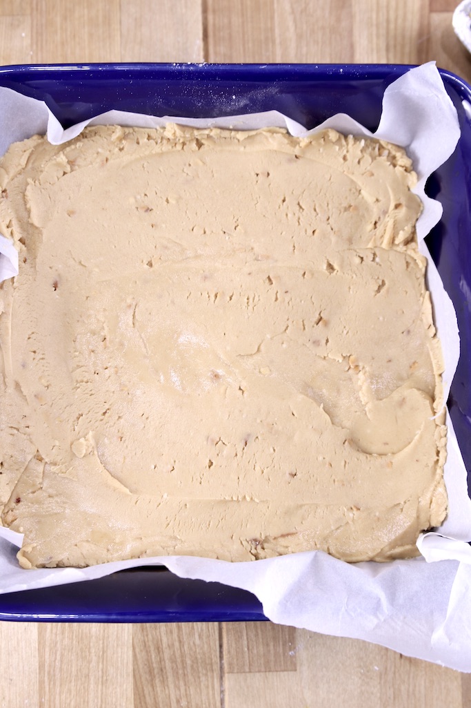 peanut butter fudge in a parchment lined pan