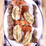 Platter of grilled lobster tails and steak kabobs