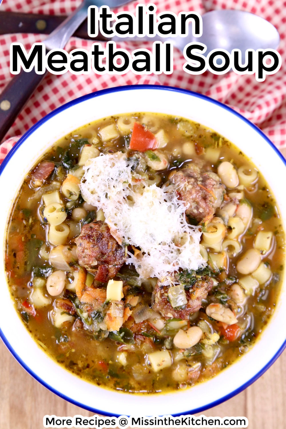 Italian Meatball Soup in a bowl with grated Parmesan, text overlay