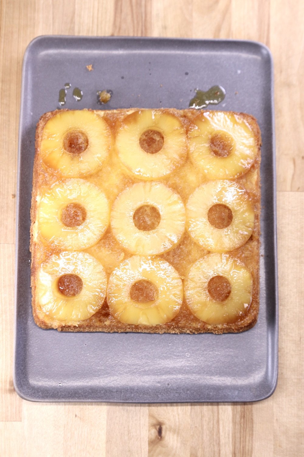 gray platter with baked pineapple upside down cake