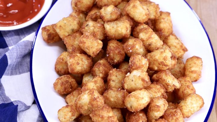 Tater Tots on a platter, cup of ketcup